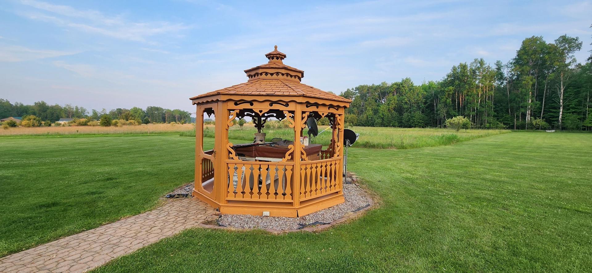 Freshly cleaned decks and gazebo after power washing in Prescott, MI