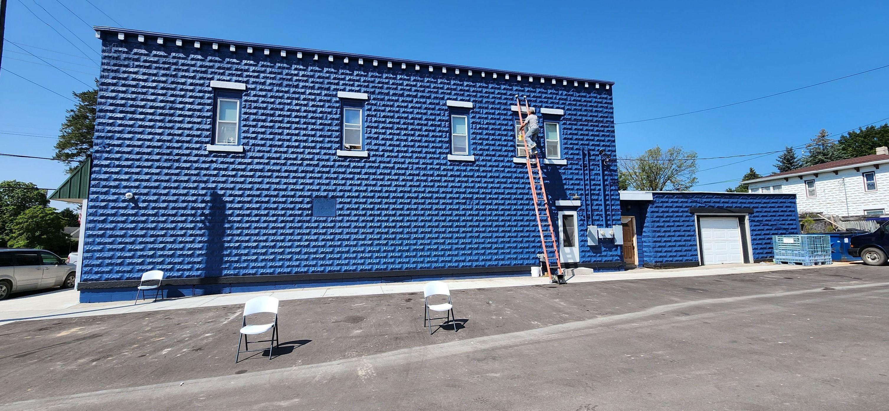 Freshly painted exterior of Cliff’s Bar in Sterling, MI